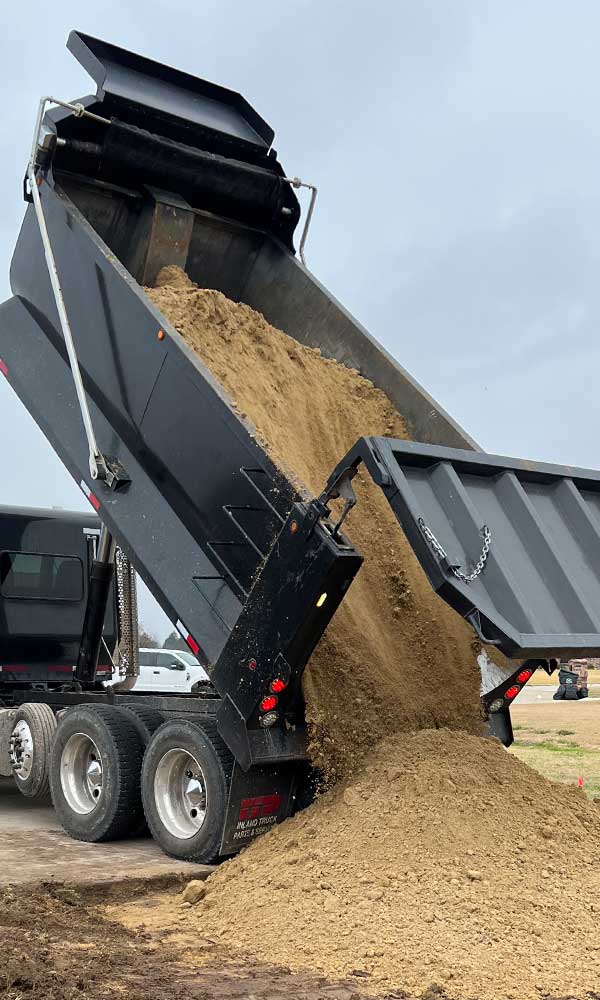 Gravel delivery for driveway and pad installation in Charlotte