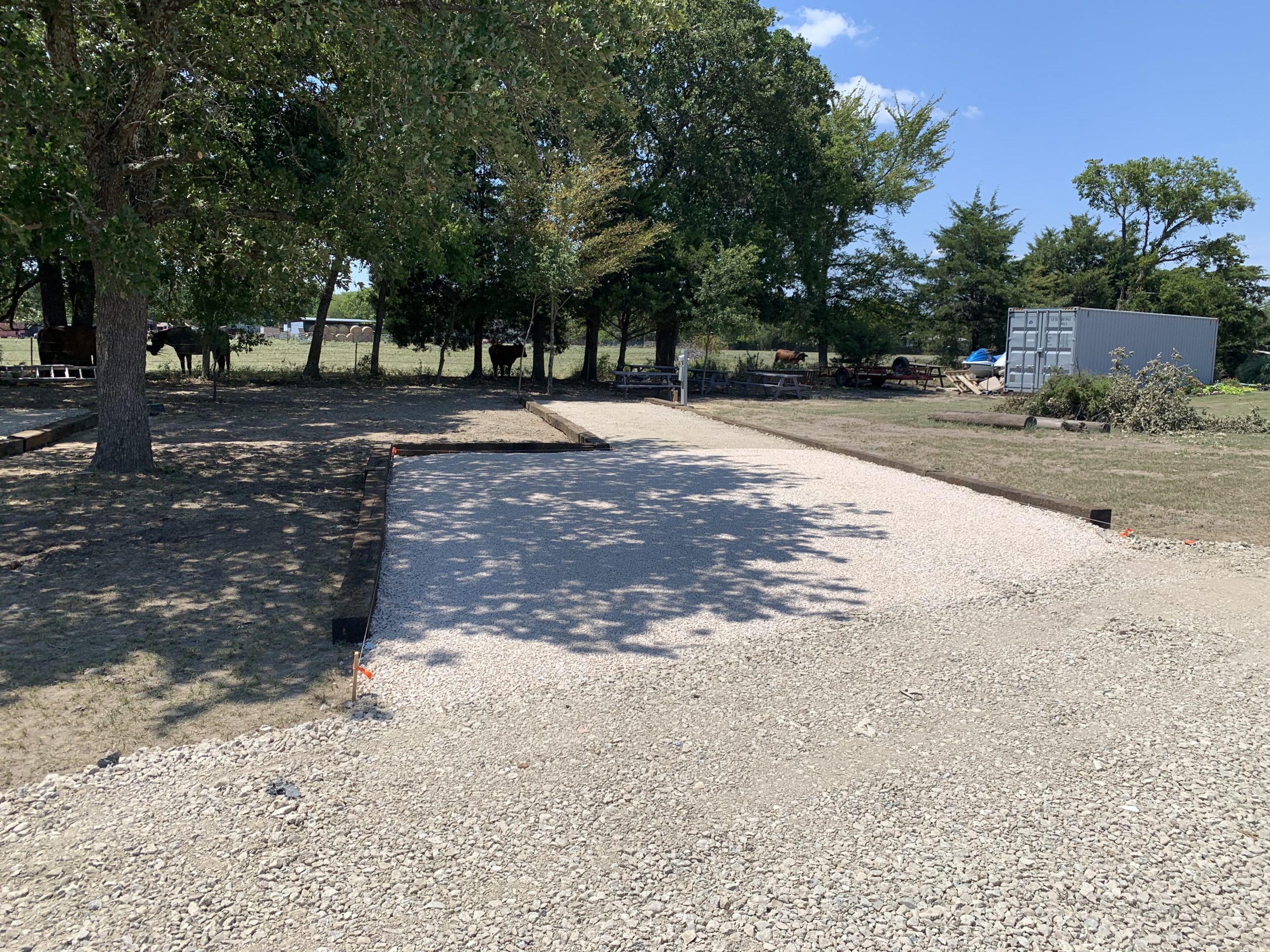RV parking pad gravel installation on a commercial property in Charlotte