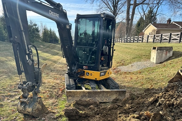 Mini excavator working on a residential lot in Charlotte
